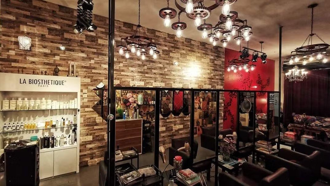 Inside Inch Hair Salon, with brick walls and chandeliers